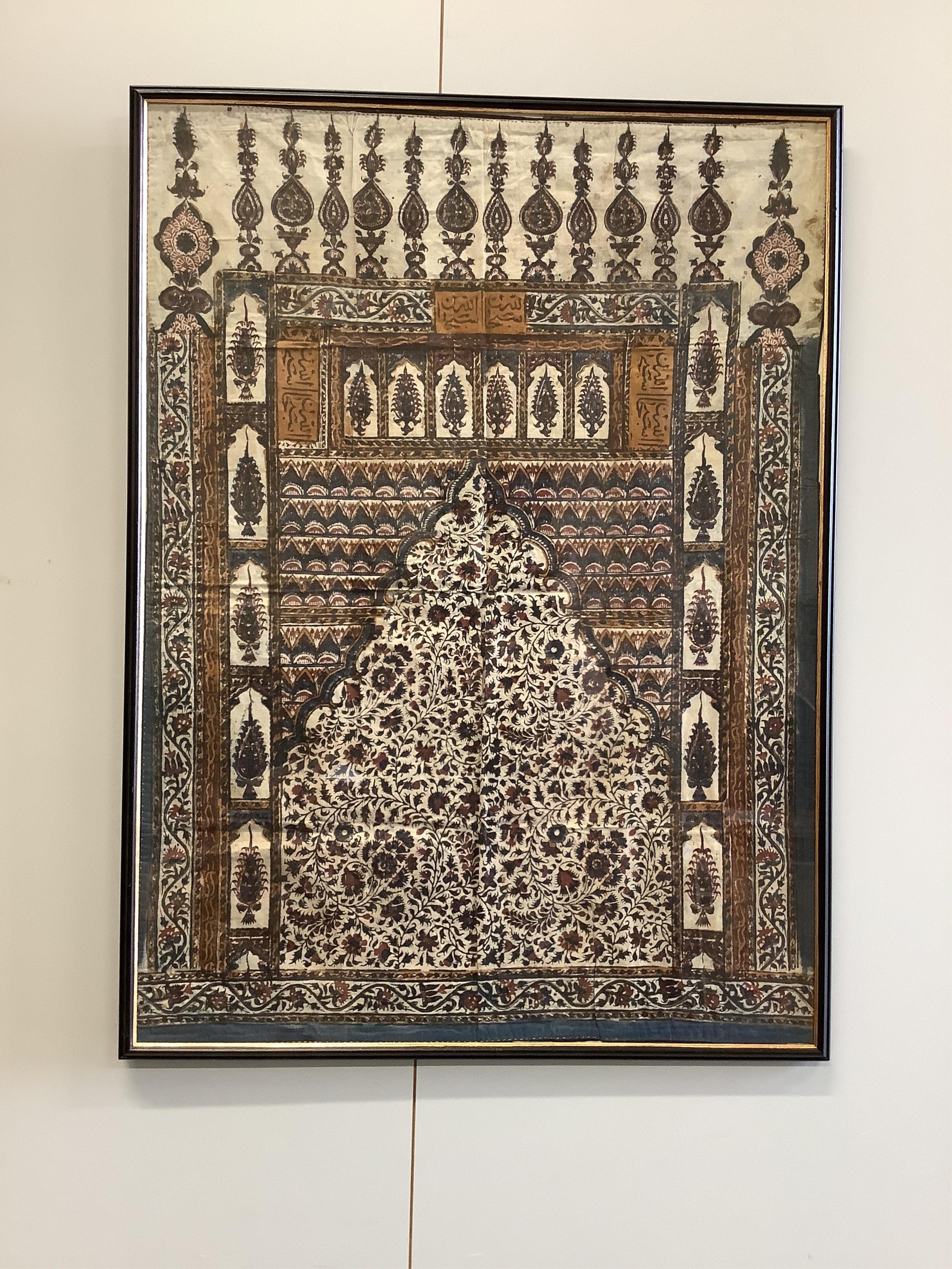 Two framed 19th century Indian Kalamkari boteh block printed prayer Niches, possibly from Machilitanam and a similar framed block printed square, possibly part of a table cover, largest 53cm wide x 67cm high (3). Conditi